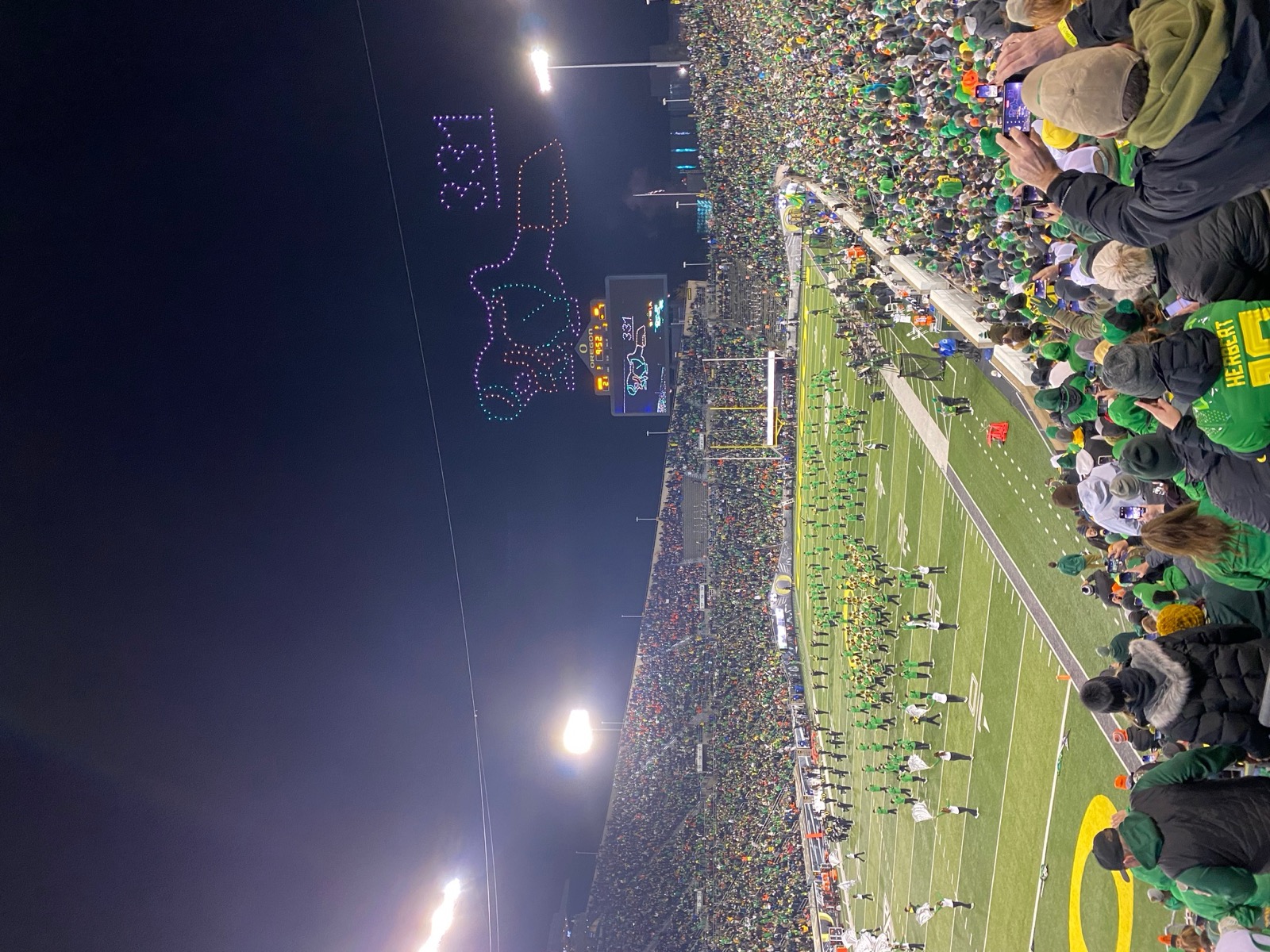 Aerial view of Autzen Stadium on game day with the Duck mascot on the field