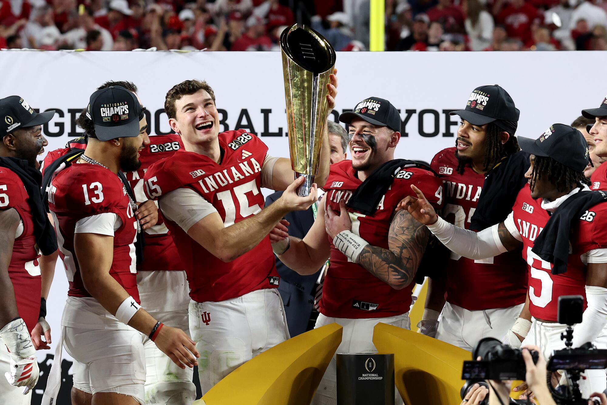 Indiana Hoosiers celebrate with the national championship trophy after beating Oregon in the Peach Bowl
