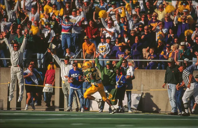 Kenny Wheaton runs past the crowd after The Pick interception against Washington, 1994