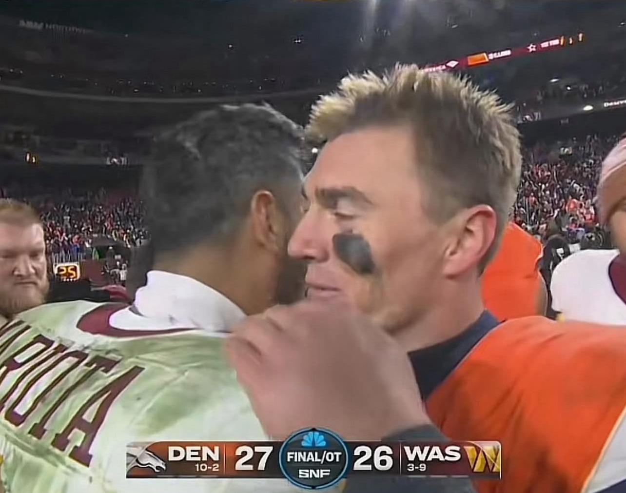 Bo Nix and Marcus Mariota embrace after an NFL game, two former Oregon Ducks