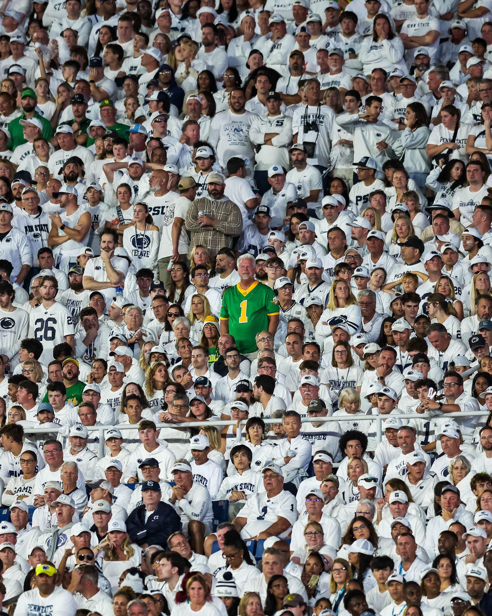 One Oregon fan in green surrounded by 107,000 Penn State fans in white at the White Out